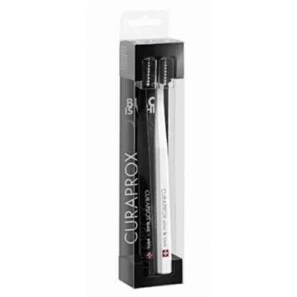 Curaprox Black is White Escova Dentes Branca + Preta escovas de dentes, de cor preta e branca, ideal para a higiene oral diária.